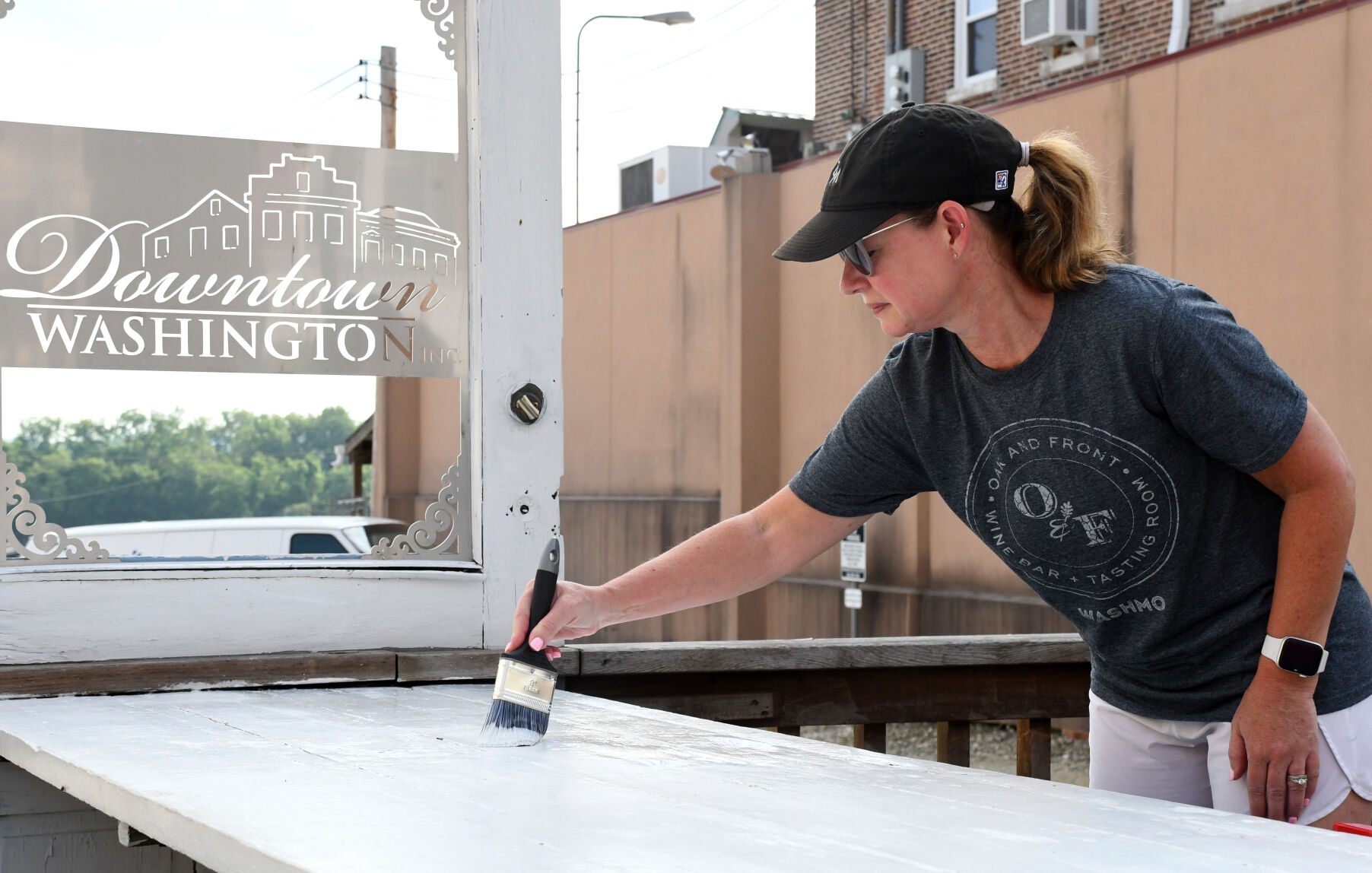 Lara Conway paints a table